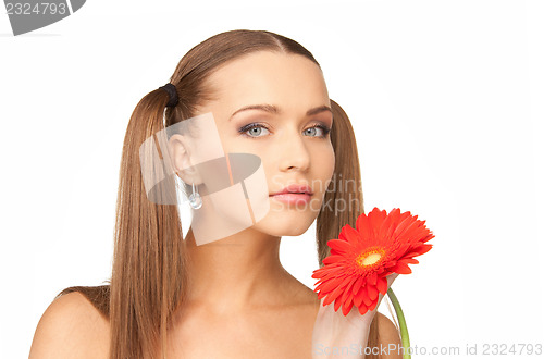Image of lovely woman with red flower