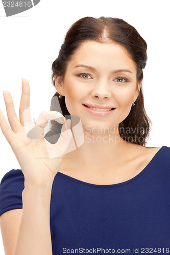 Image of lovely teenage girl showing ok sign