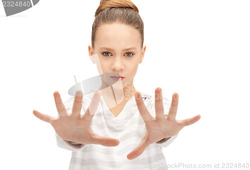 Image of teenage girl making stop gesture