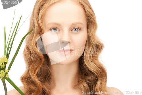 Image of woman with green sprout