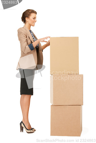 Image of attractive businesswoman with big boxes