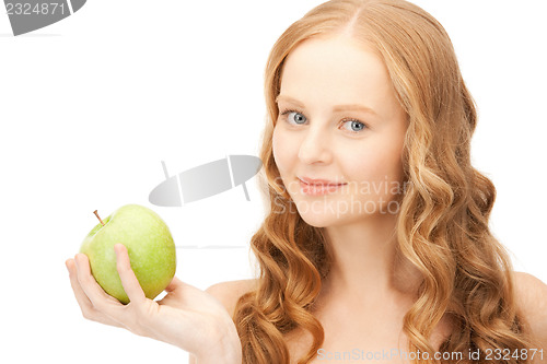 Image of young beautiful woman with green apple