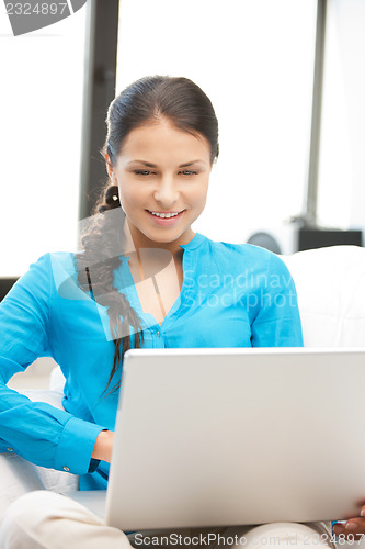 Image of happy woman with laptop computer