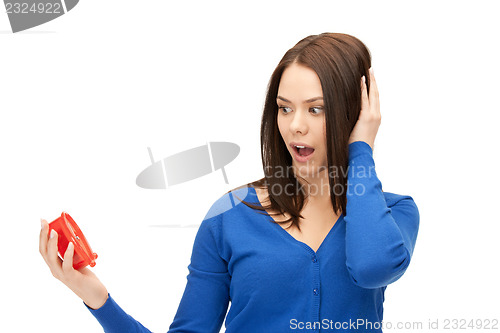 Image of woman holding alarm clock