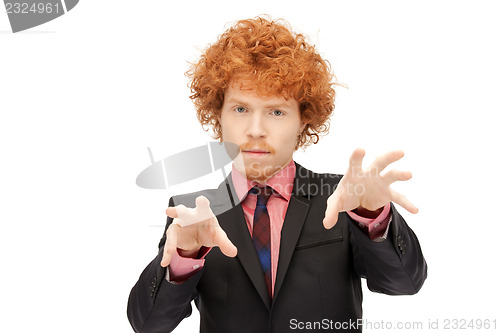 Image of businessman working with something imaginary