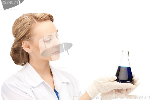 Image of lab worker holding up test tube