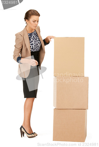 Image of attractive businesswoman with big boxes