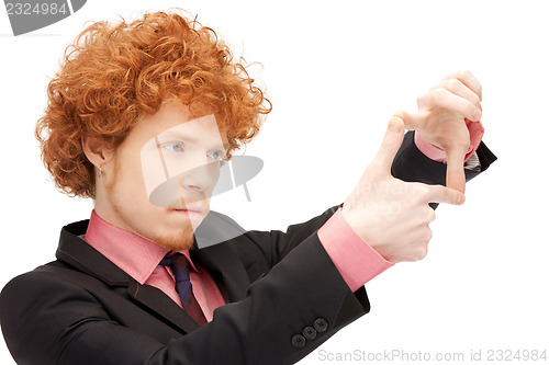 Image of handsome man creating a frame with fingers