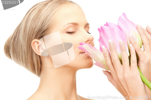Image of beautiful woman with lotus flower