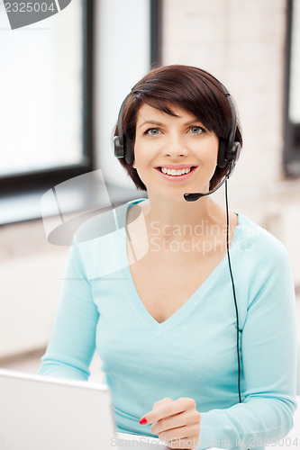 Image of helpline operator with laptop computer