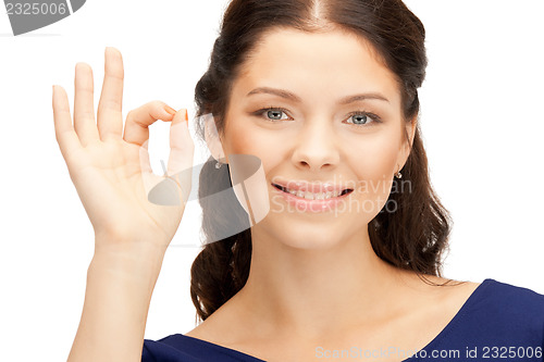 Image of lovely teenage girl showing ok sign
