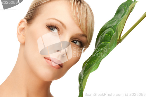 Image of woman with green leaf