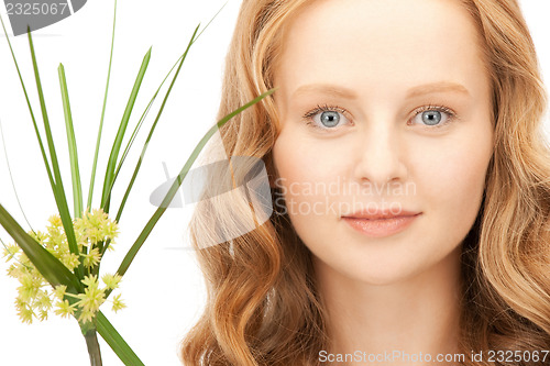 Image of woman with green sprout
