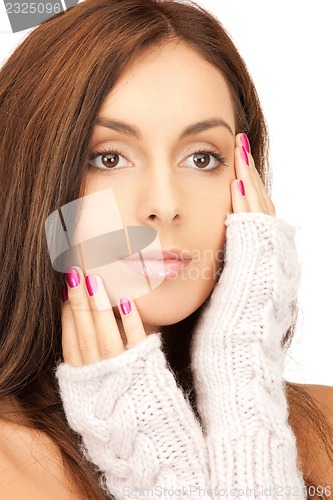 Image of beautiful woman in mittens