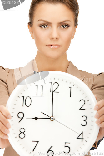 Image of woman holding big clock