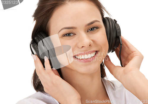Image of happy teenage girl in big headphones