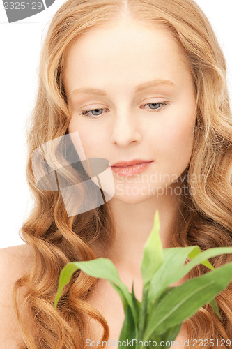 Image of woman with green sprout
