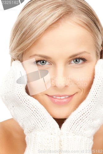 Image of beautiful woman in mittens
