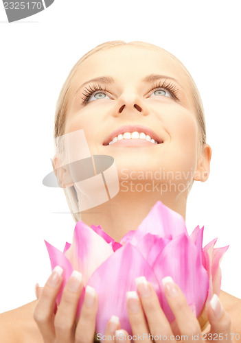 Image of beautiful woman with lotus flower