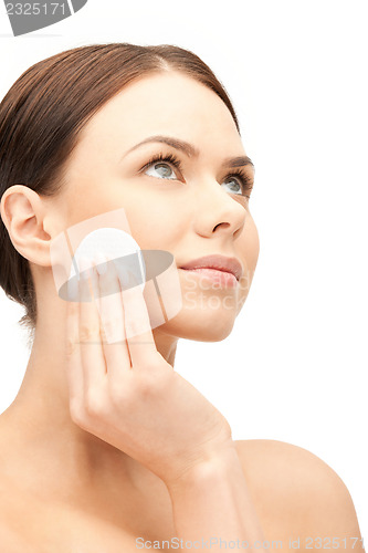 Image of beautiful woman with cotton pad