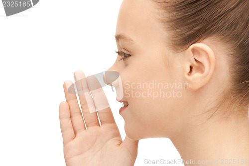 Image of teenage girl whispering gossip