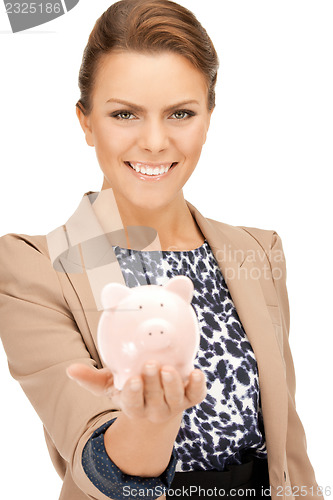 Image of lovely woman with piggy bank