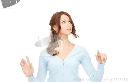 Image of businesswoman working with something imaginary