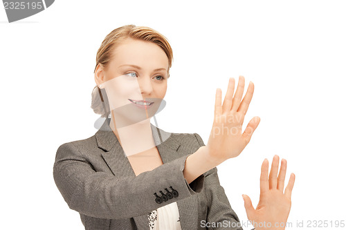 Image of businesswoman working with something imaginary