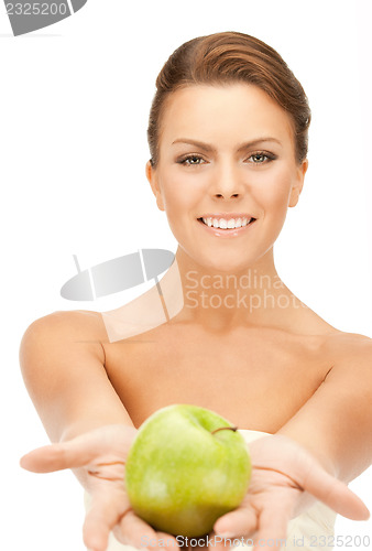 Image of young beautiful woman with green apple