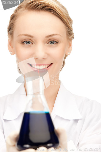 Image of lab worker holding up test tube