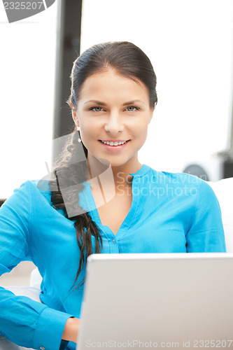 Image of happy woman with laptop computer