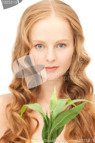 Image of woman with green sprout