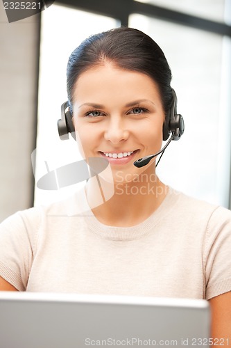 Image of helpline operator with laptop computer