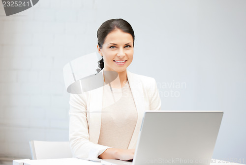 Image of happy woman with laptop computer