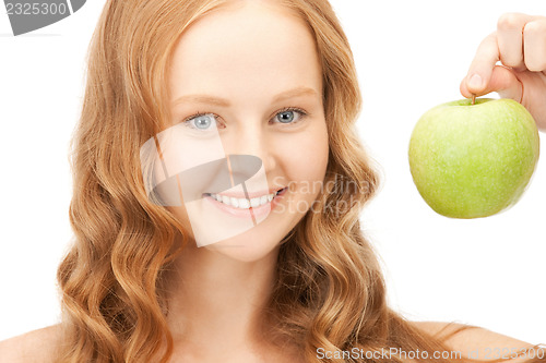 Image of young beautiful woman with green apple