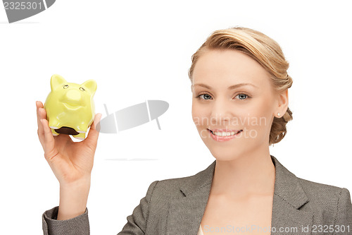 Image of lovely woman with piggy bank