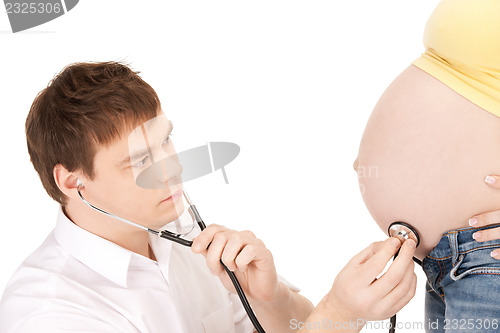 Image of doctor and pregnant woman belly