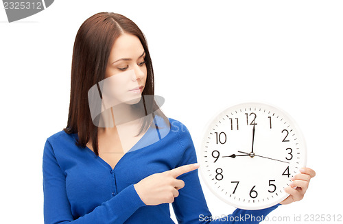 Image of woman holding big clock