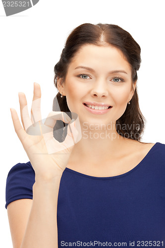 Image of lovely teenage girl showing ok sign