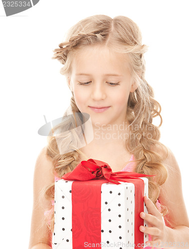 Image of happy little girl with gift box
