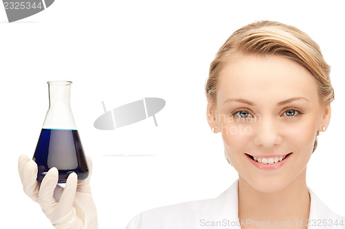 Image of lab worker holding up test tube