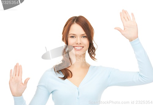 Image of businesswoman working with something imaginary