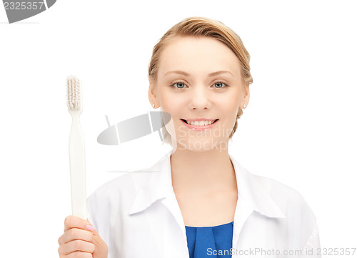 Image of doctor with toothbrush