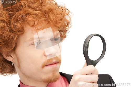 Image of man with magnifying glass