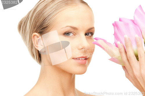 Image of beautiful woman with lotus flower