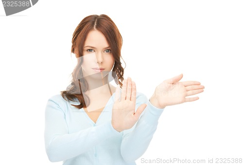 Image of businesswoman working with something imaginary