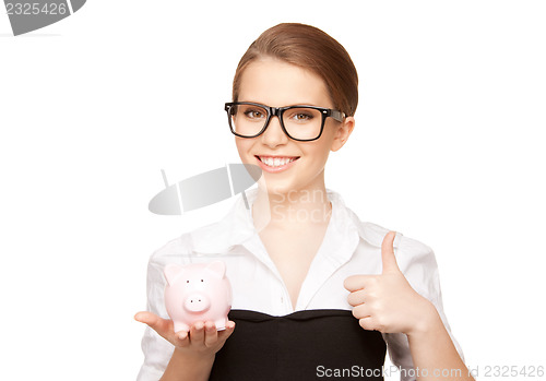 Image of lovely woman with piggy bank