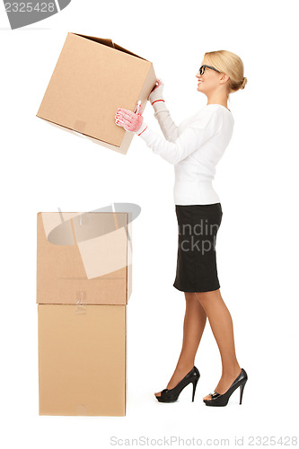 Image of attractive businesswoman with big boxes