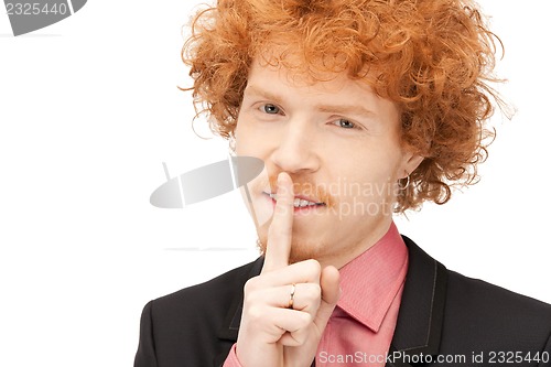 Image of finger on lips