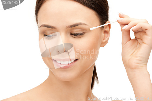 Image of beautiful woman with cotton bud